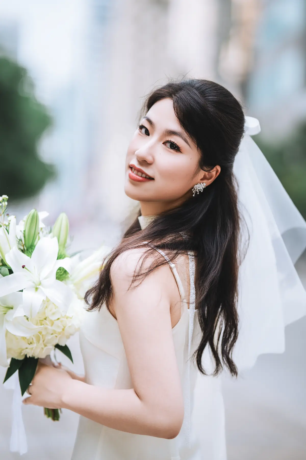 Soft bridal portrait with loose waves by Elaine