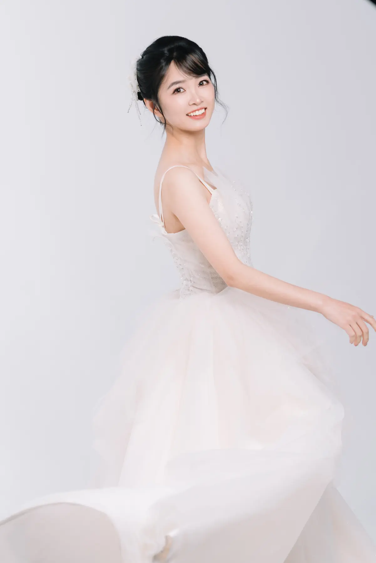 Soft bridal portrait in a light tulle gown