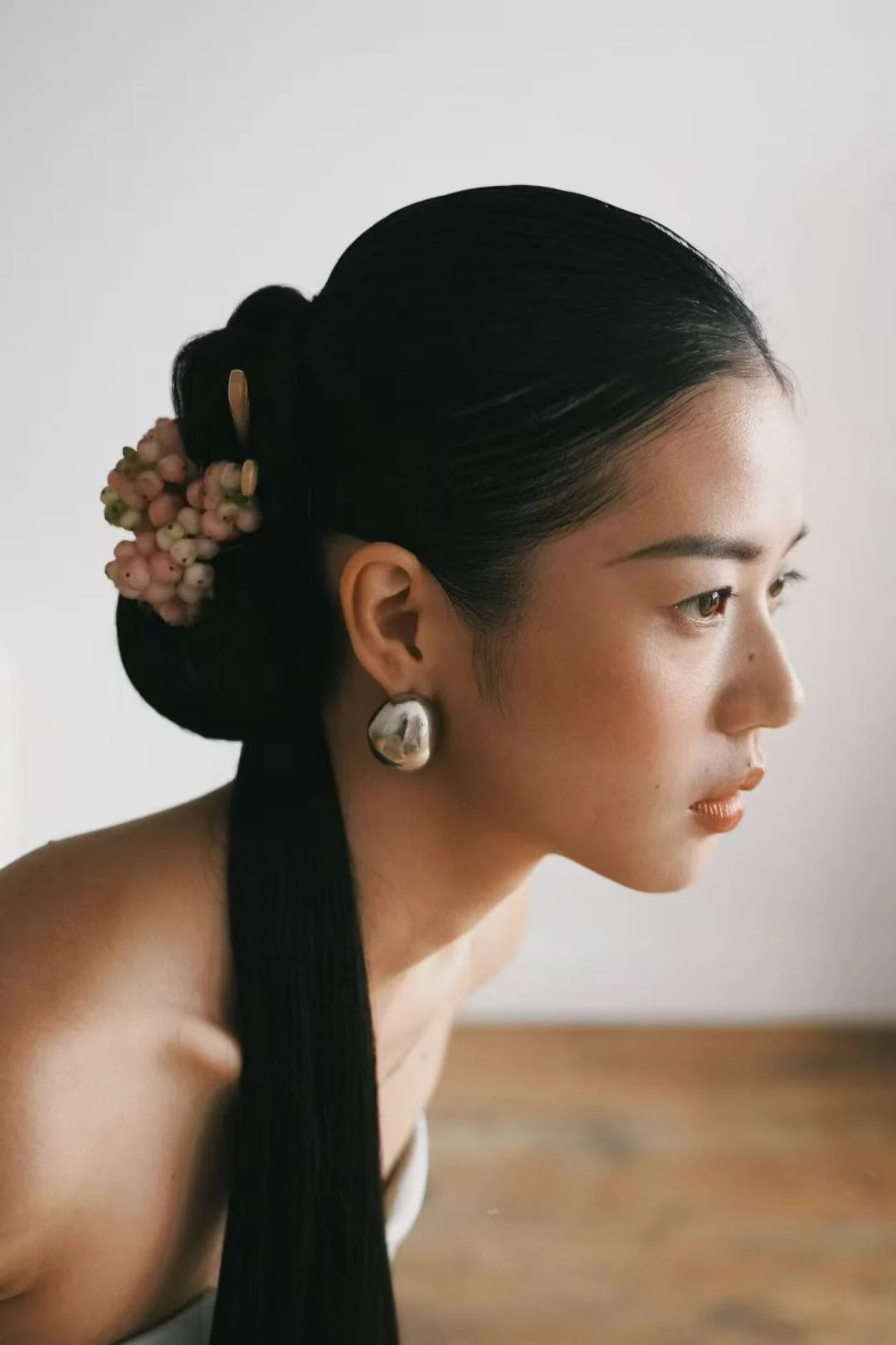 Bridal makeup and floral updo detail by Mira