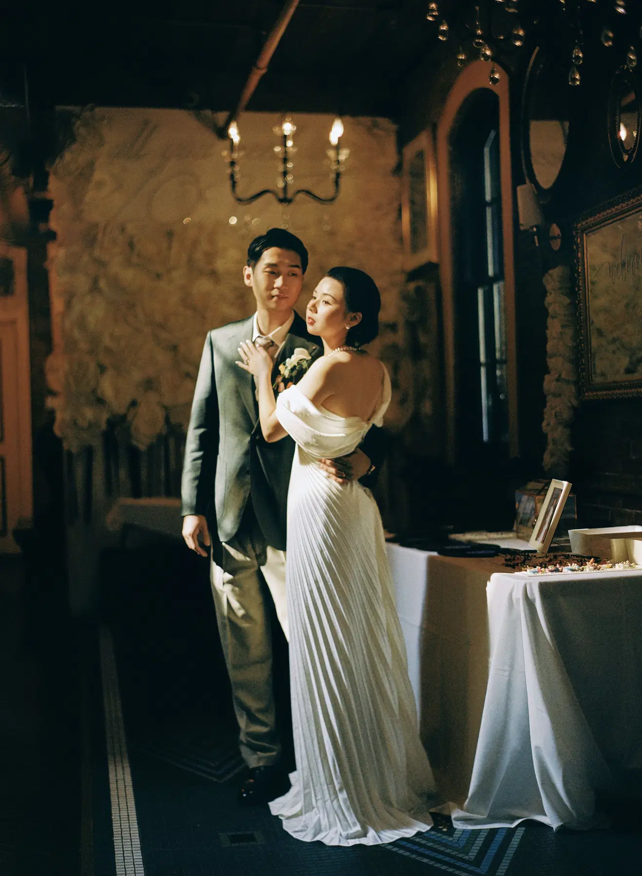 Candlelit wedding portrait in a historic room