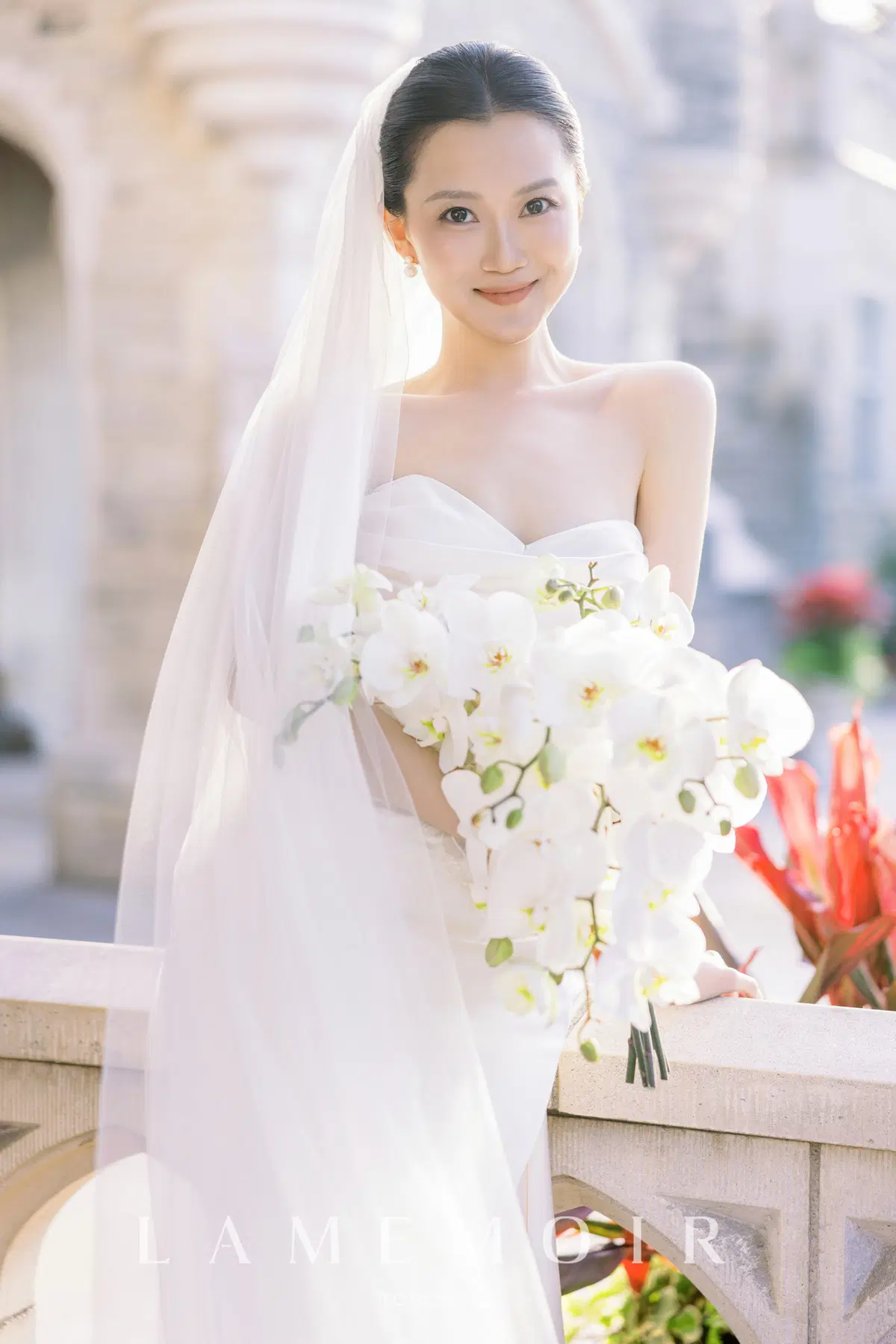 Bright bridal portrait with white orchids
